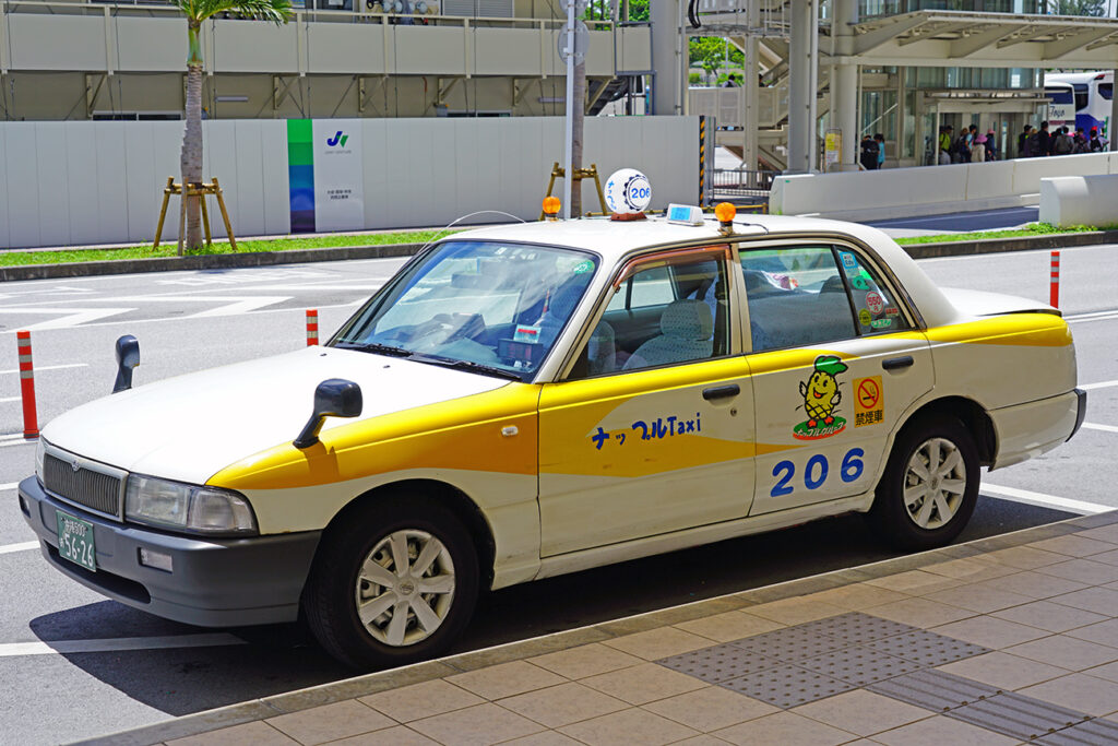 NAHA, JAPAN -29 JUN 2017- View of a taxi outside the Naha Airport (OKA), the main commercial airport in Okinawa in the south of Japan.